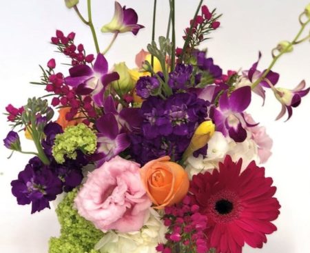 Bold, bright and beautiful, this modern cube arrangement is overflowing with orchids, hydrangea, roses, viburnum, lisianthus, Gerberas, stock and beautiful accent flowers hand selected by our talented designers.